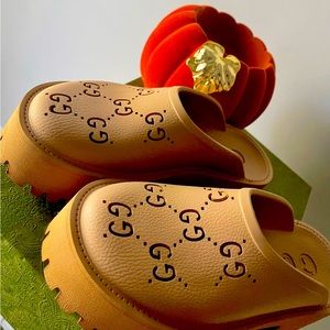 Authentic Gucci GG slide-on sandal.